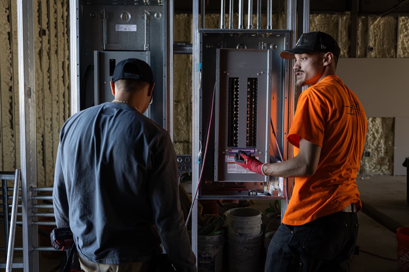 Electricians commissioning a panel on a FulcrumPoint portfolio site