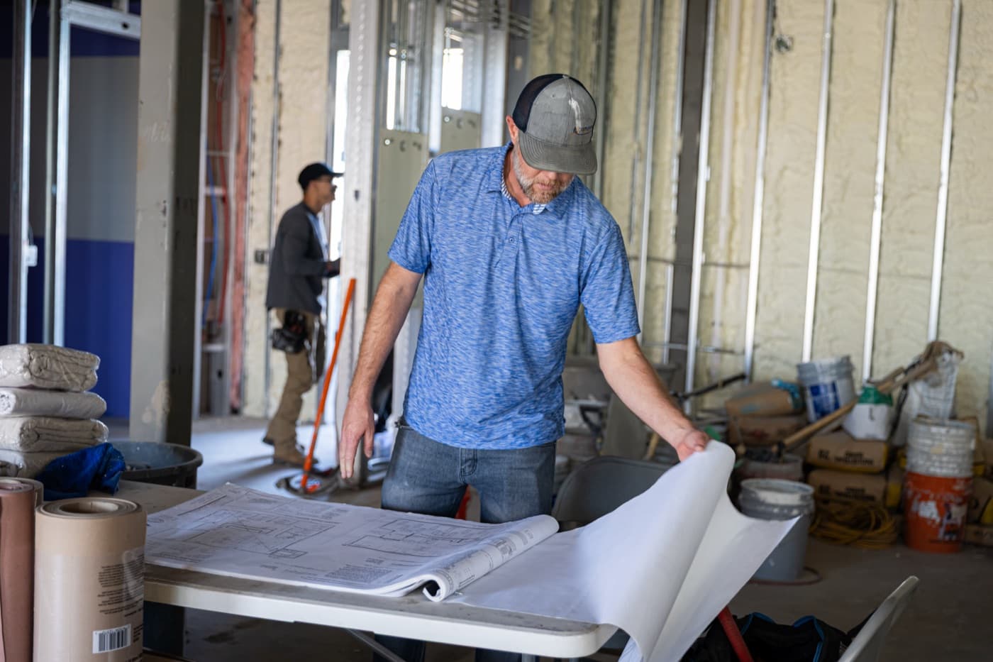 FulcrumPoint operator reviewing blueprints on-site